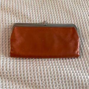 Hobo clutch in a peach color
